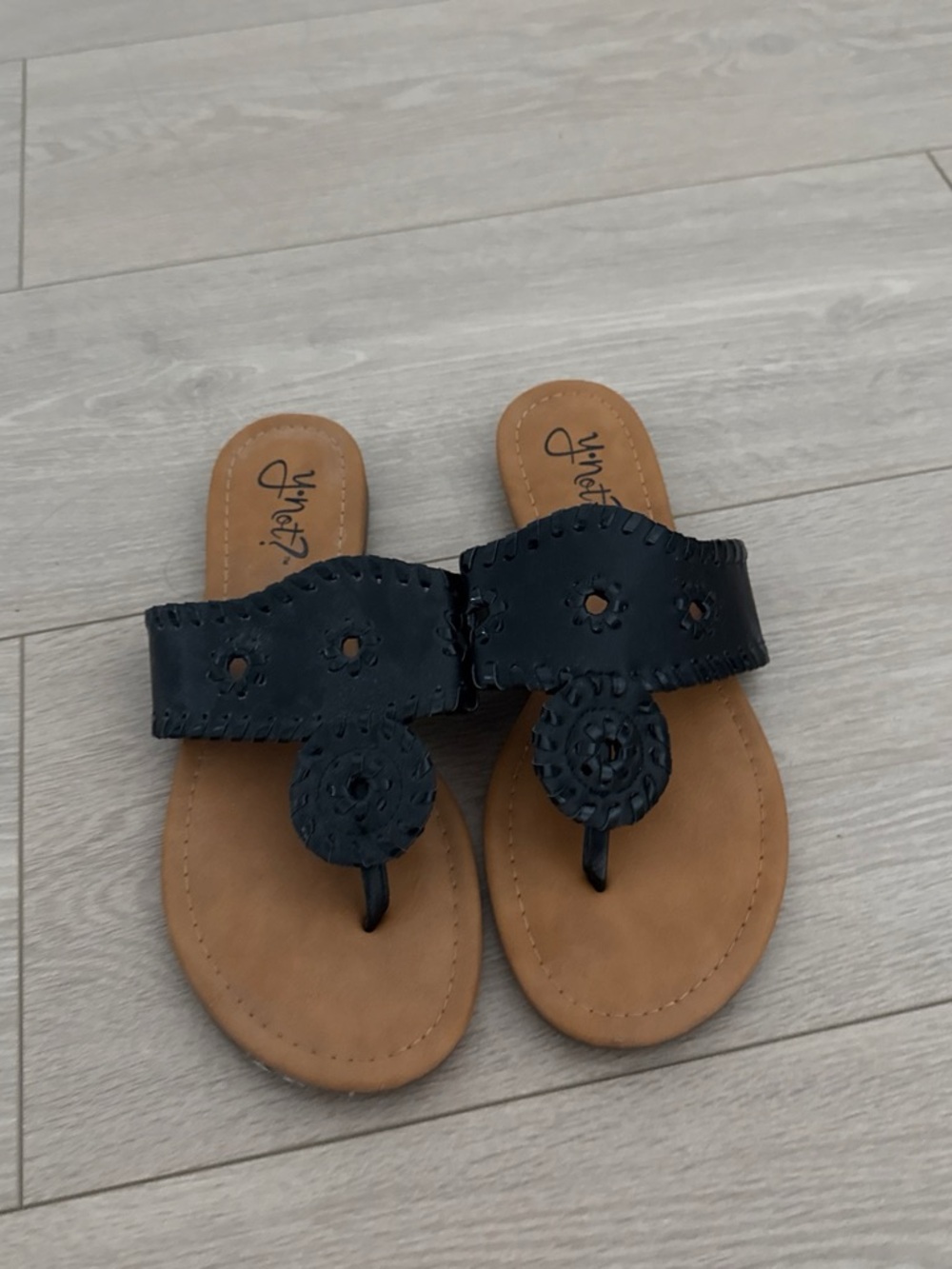 Black Leather Thong Sandals with Decorative Medallion